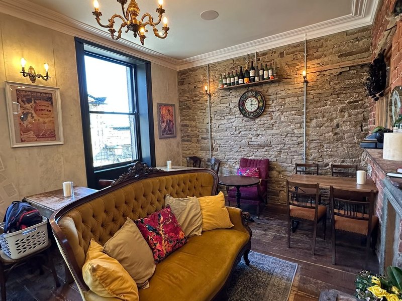 The Champagne Room, with a chandelier and sofas