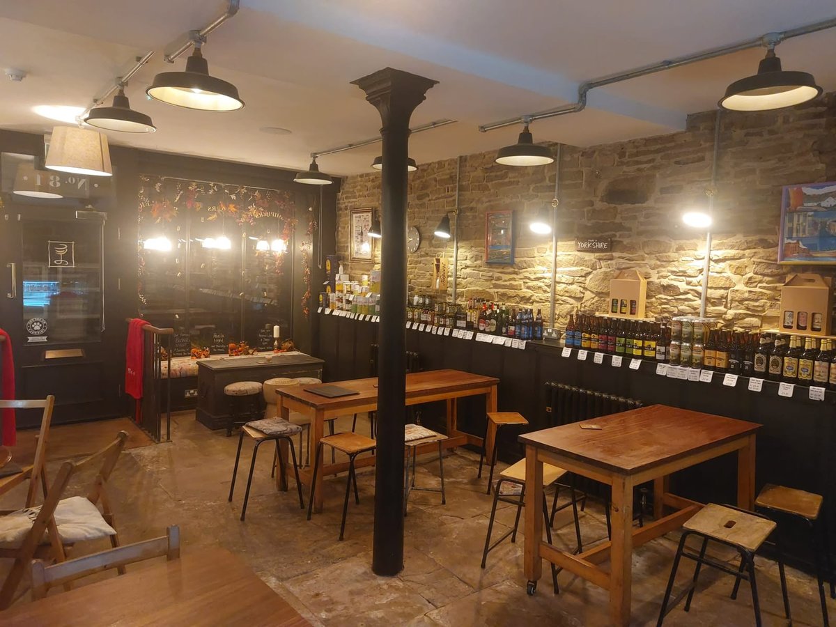 The ground floor bar, with tables and the wine wall